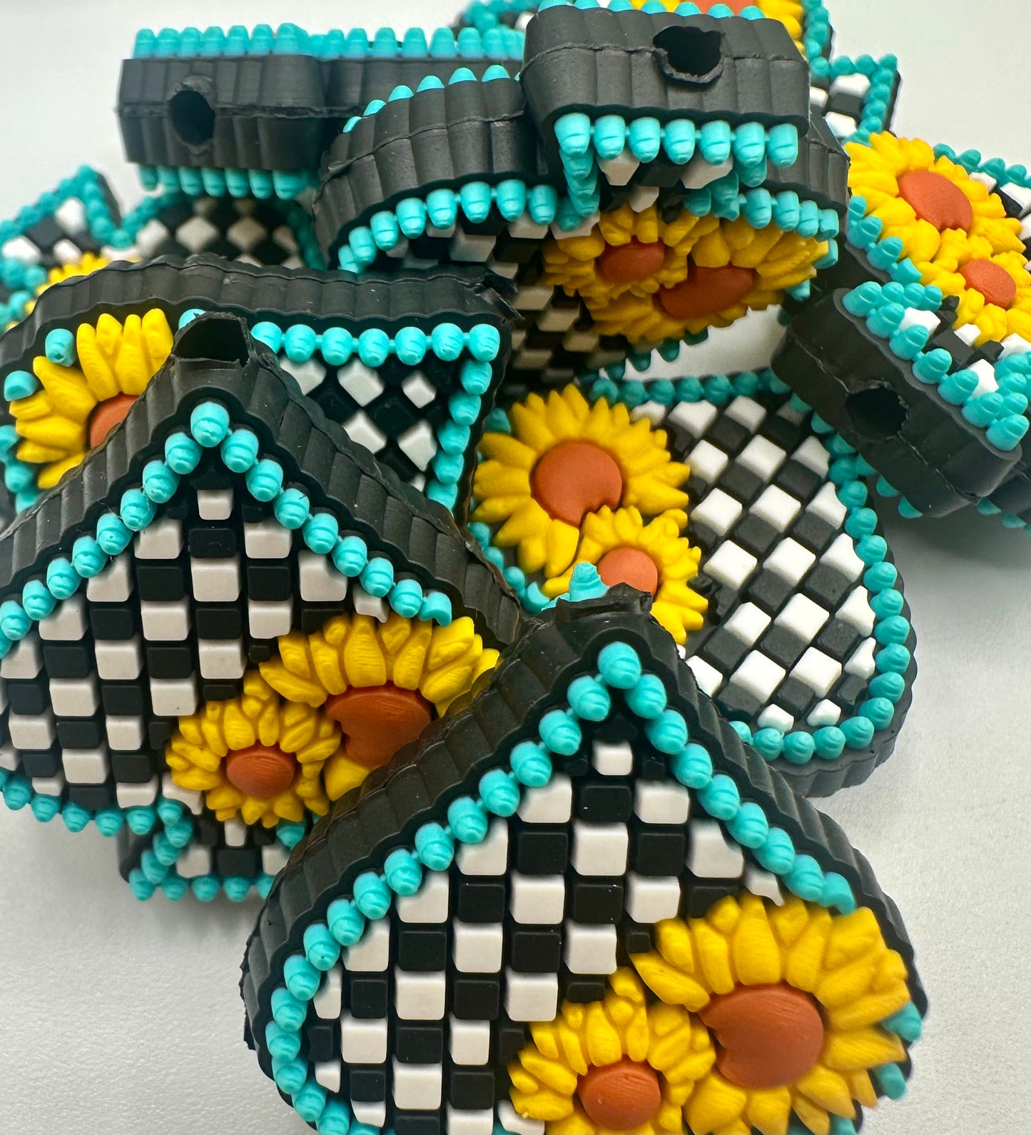 spade with sunflower and checkered pattern