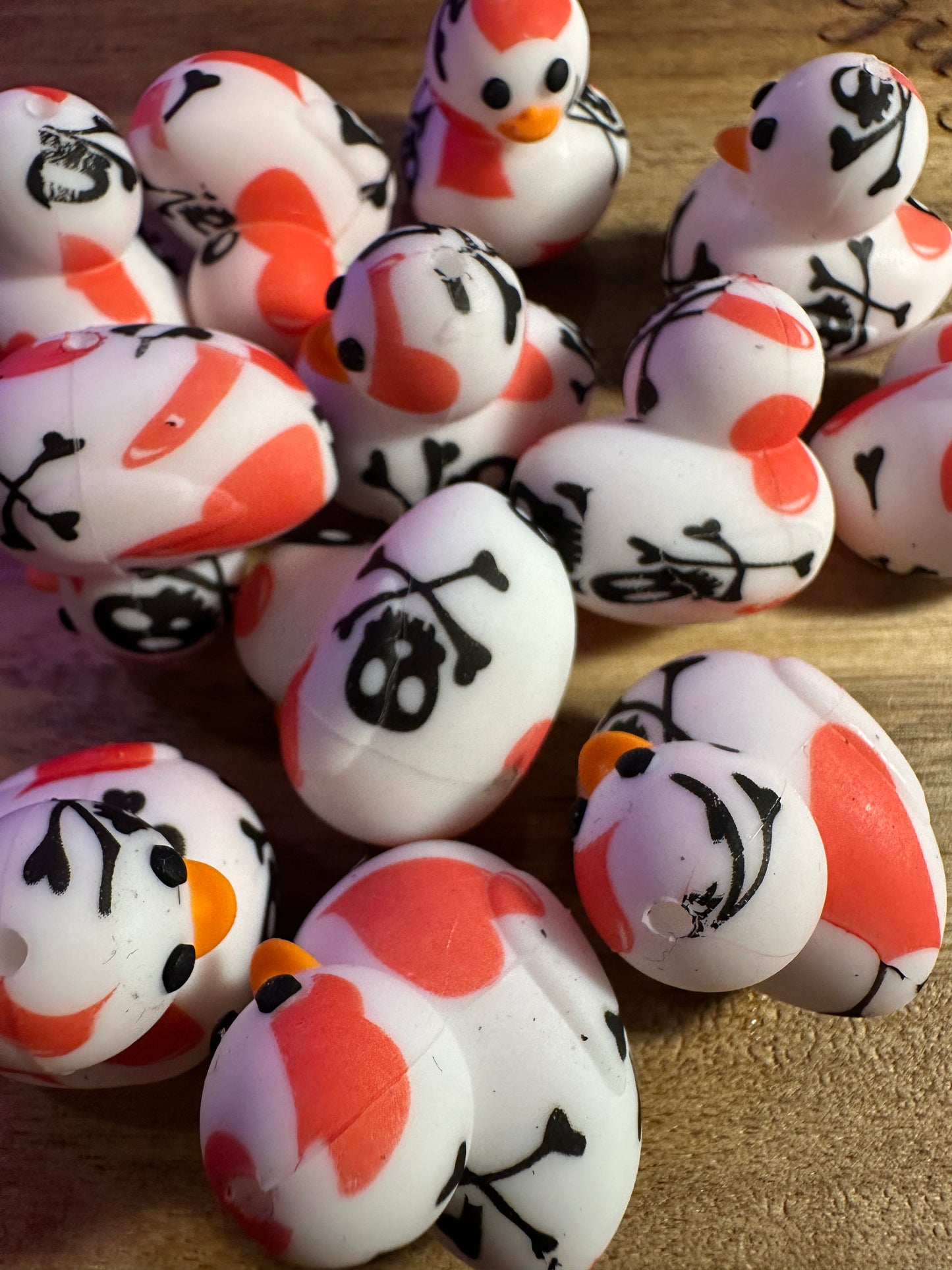 3d duck silicone focal bead with hearts, skulls and crossbones